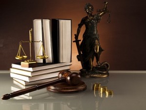 Statue of Lady Justice, gavel and books,coins